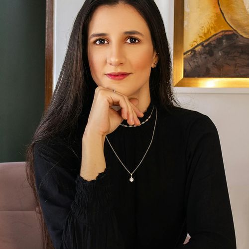 A person sitting peacefully after a gentle workout session, looking relaxed
